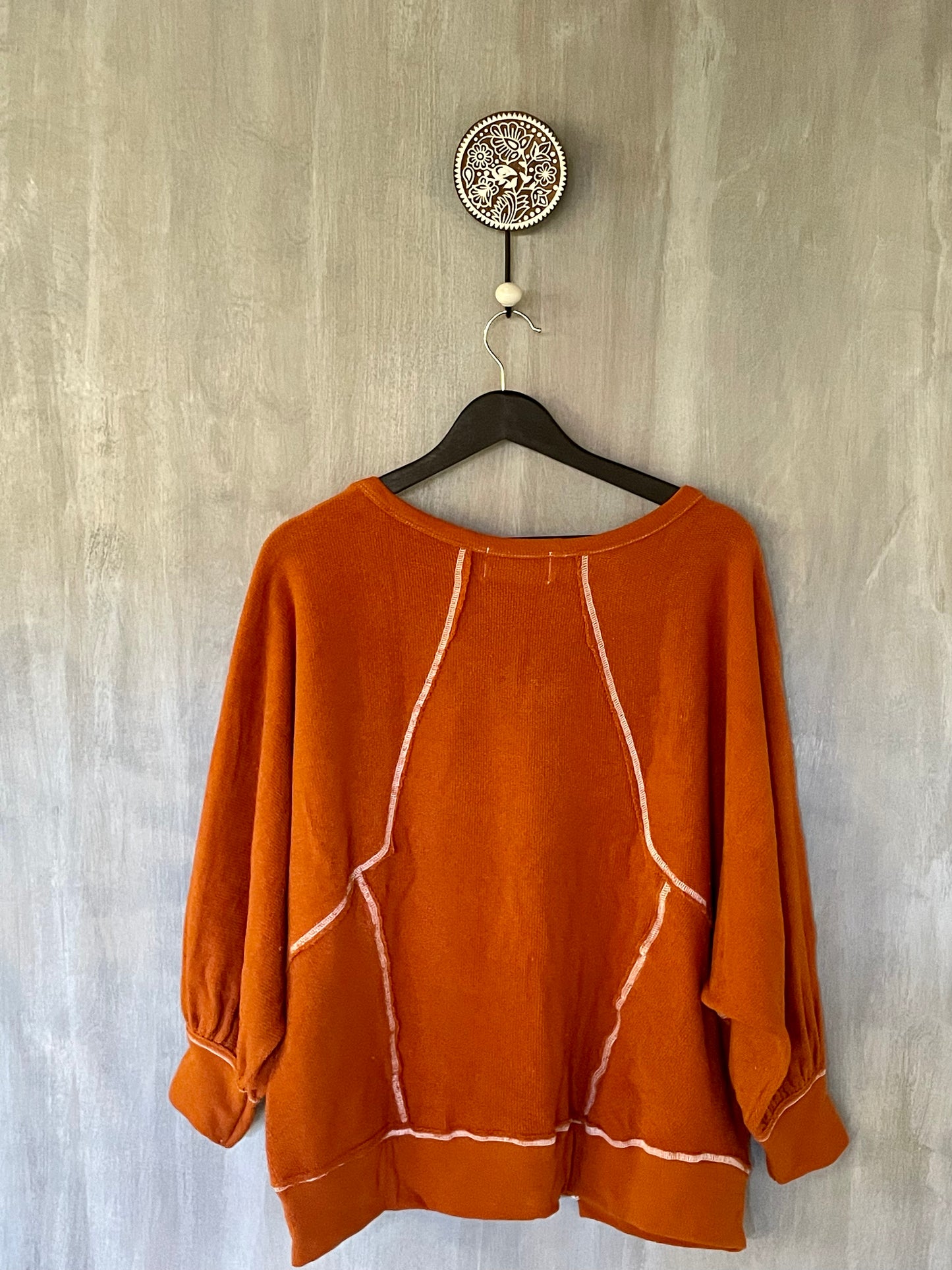 Reverse stitch dolman sleeve light weight pullover top